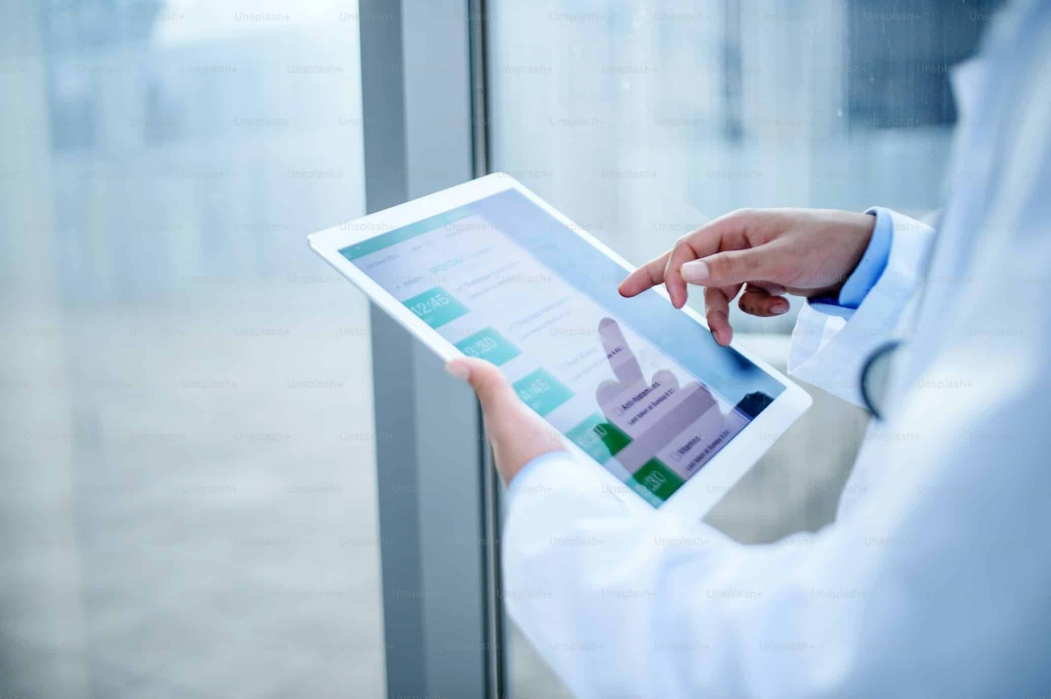 a doctor using a tablet